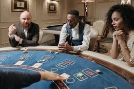 Filipino player watching a live dealer baccarat table on slot monitor